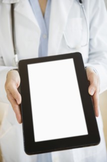 Mixed race doctor showing digital tablet