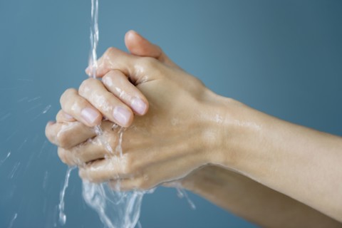 Close up of mixed race woman washing her hands