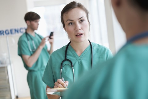 Doctors talking in hospital emergency room