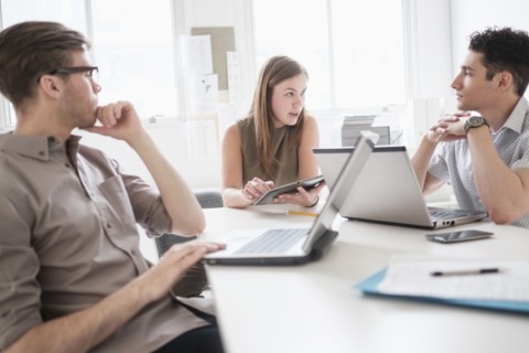 Business people using technology in office meeting