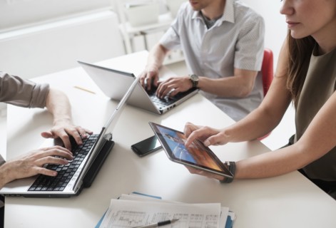 Business people using technology in office meeting