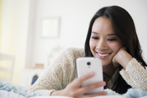 Chinese woman using cell phone