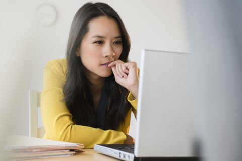 Chinese businesswoman using laptop