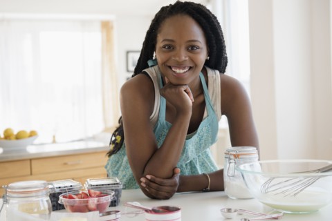 Black woman baking in kitchen