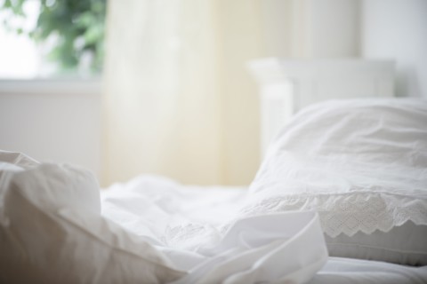 Messy sheets on bed