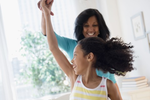 Mother and daughter dancing