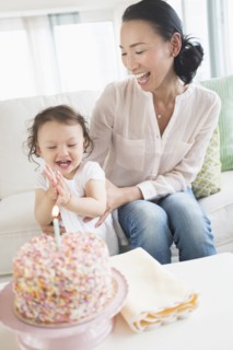 Mother and baby daughter celebrating birthday