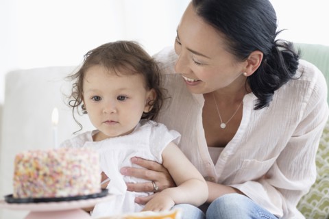 Mother and baby daughter celebrating birthday