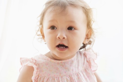 Mixed race baby girl with mouth open