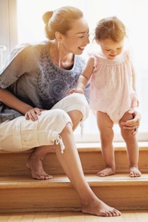 Mother and baby daughter on steps