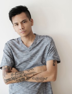 Serious Asian man with arms crossed
