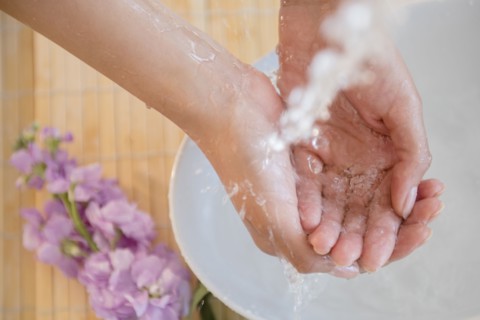 Hispanic woman washing hands