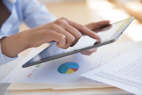 Hispanic businesswoman using digital tablet