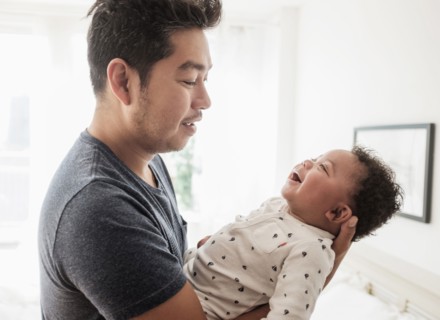 Father holding baby son