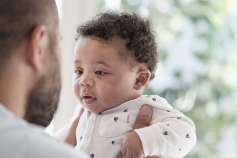 Father holding baby son