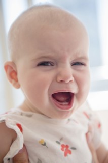Caucasian baby girl crying