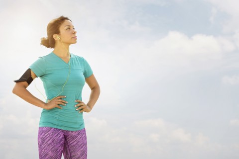 Mixed race runner standing outdoors