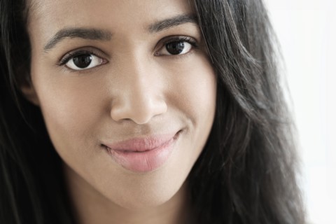 Close up of mixed race woman smiling