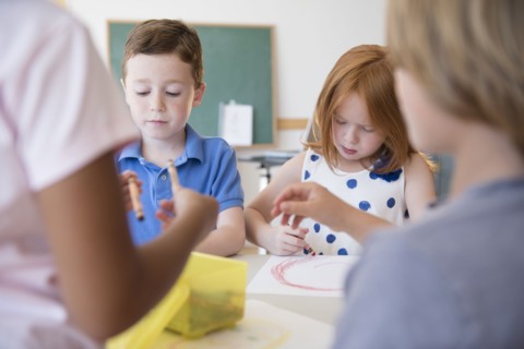 Students drawing in classroom