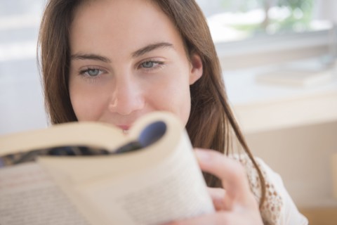 Native American woman reading book
