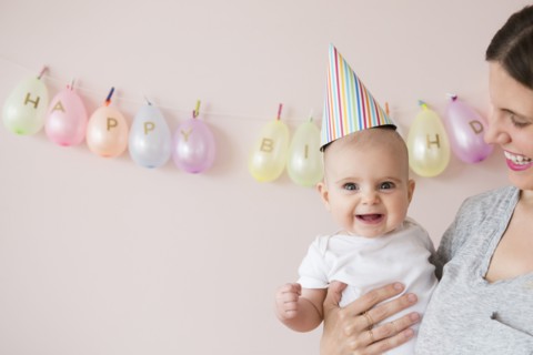 Caucasian mother and daughter celebrating birthday