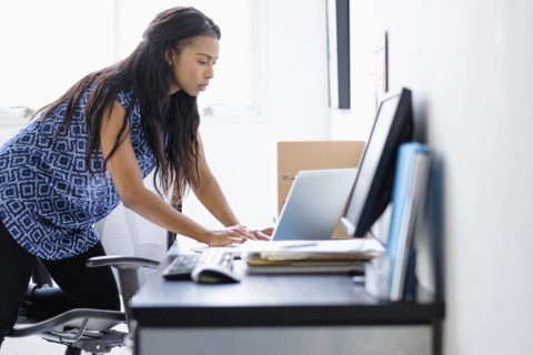 Mixed race businesswoman working in office