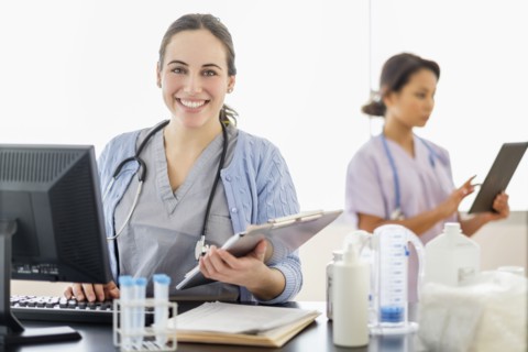 Nurse holding medical chart in hospital