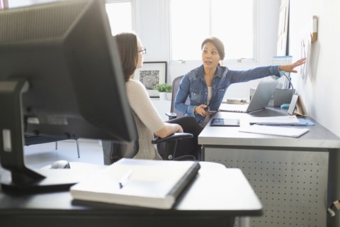 Businesswomen talking in office
