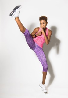 Mixed race athlete kicking