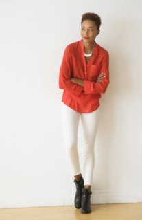 Mixed race woman standing with arms crossed