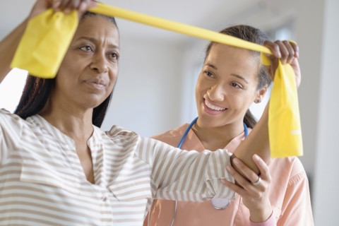 Patient having physical therapy in living room