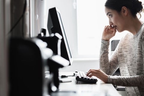 Hispanic woman using computer