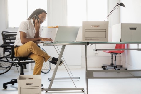 Black businessman working in new office