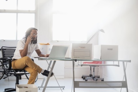 Black businessman working in new office
