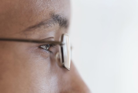 Close up profile of eyes and eyeglasses of Black man