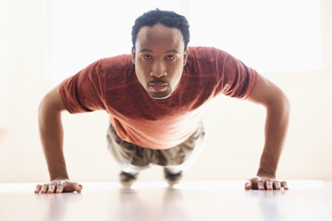 Black man doing push-ups