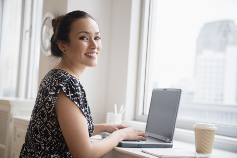 Businesswoman working on laptop in office