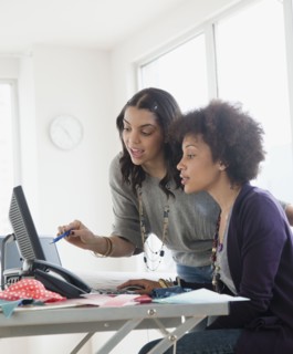 Businesswoman working in office together