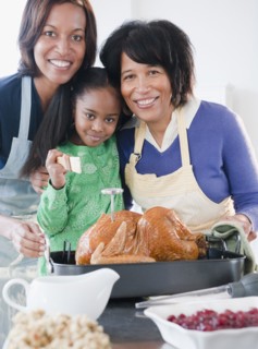 Black family preparing Thanksgiving dinner