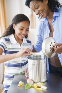 Mother and daughter composting together