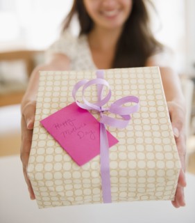 Indian woman holding out Mother's Day gift