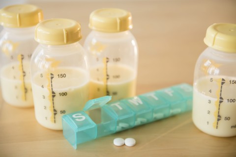 Pill box and bottles of breast milk