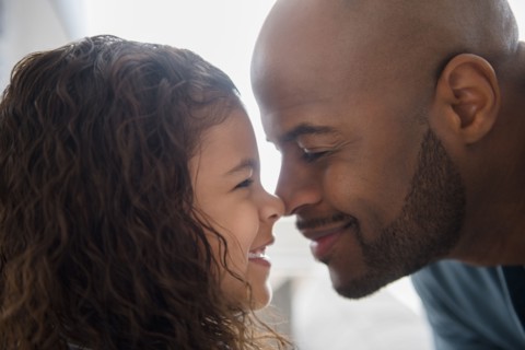 Father and daughter rubbing noses