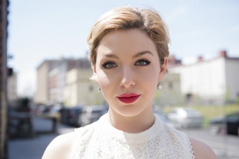 Serious Caucasian woman in city