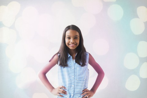 Smiling Mixed Race girl posing