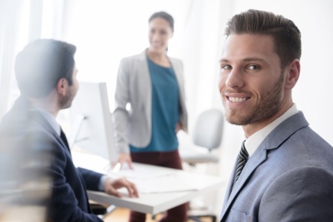 Portrait of smiling businessman in office