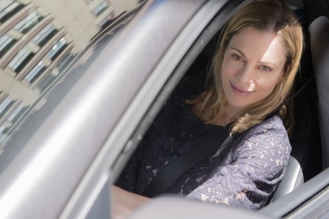 Caucasian woman driving car