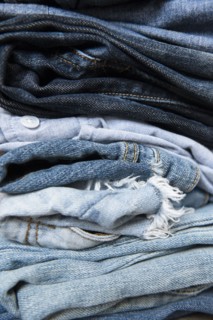 Stack of folded blue jeans