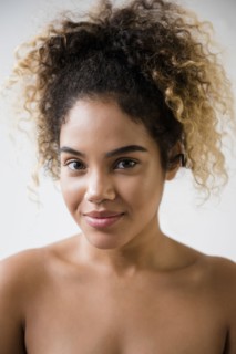 Portrait of Mixed Race woman with bare shoulders