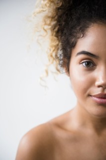 Portrait of Mixed Race woman with bare shoulders